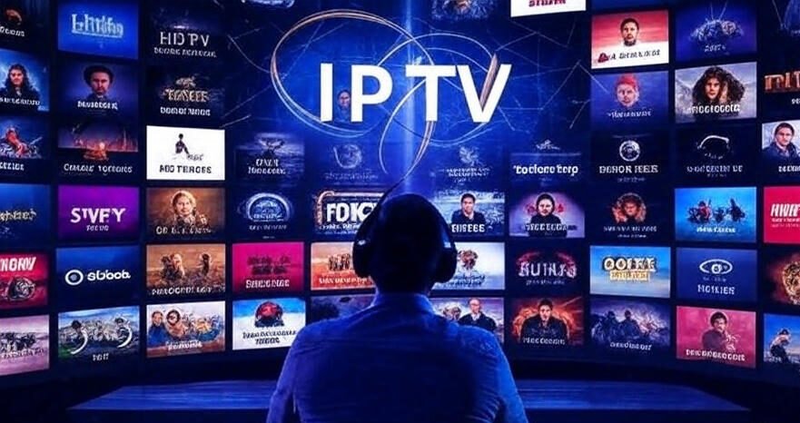 A person wearing headphones is sitting and facing a large curved screen displaying a variety of streaming service logos, including IPTV, with the word "IPTV" prominently centered in the display. The screen showcases numerous colorful thumbnails of movies, TV shows, and other media content from various platforms, arranged in a grid-like pattern. The setting appears to be a dark room, with the bright screen illuminating the scene, and the person is seated at a desk or platform.